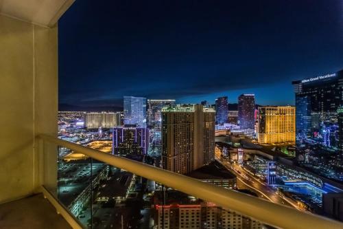 a view of a city skyline at night at Strip View Sub-Penthouse 34709 in Las Vegas