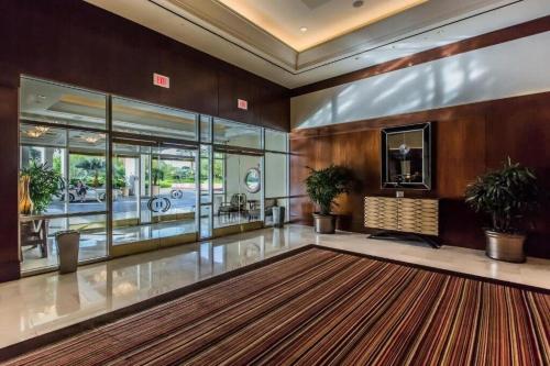 a large lobby with a large rug on the floor at Strip View Sub-Penthouse 34709 in Las Vegas