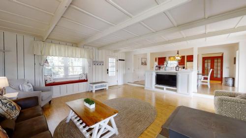 a living room with a couch and a table at Two-Bedroom House in Townsend