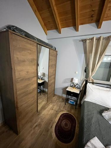 Кровать или кровати в номере Blue waves house 1