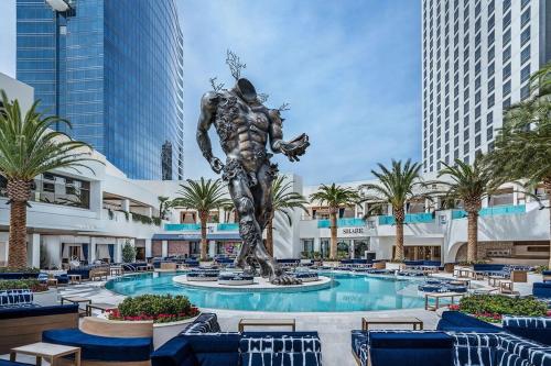 a statue in the middle of a pool at a resort at Beautiful Mountain View Palms Studio 30307 in Las Vegas