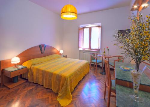 Un pat sau paturi într-o cameră la Affittacamere Villa Gigli