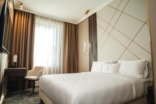 Postel nebo postele na pokoji v ubytování Old Continent Hotel