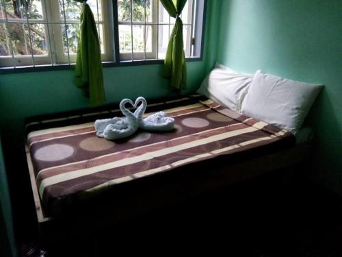 Ένα ή περισσότερα κρεβάτια σε δωμάτιο στο Hidden Hill Inn