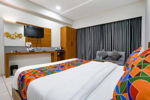 Ένα ή περισσότερα κρεβάτια σε δωμάτιο στο Hotel Asiana