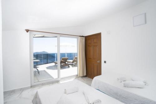 Postel nebo postele na pokoji v ubytování Villa Kubra Akbel Kas Antalya Turkey