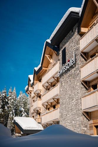 a building with the swarovski sign on it at Swissôtel Resort Kolasin in Kolašin