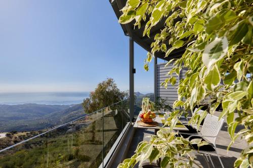 a balcony with a view of the mountains at Seli in Amirás