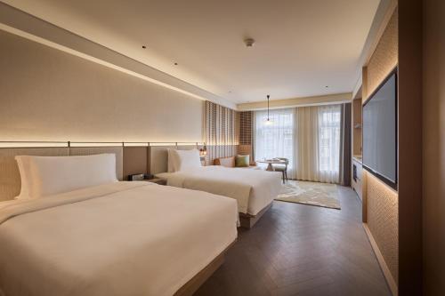 Katil atau katil-katil dalam bilik di Ming Hotel Nanjing - MGallery Collection