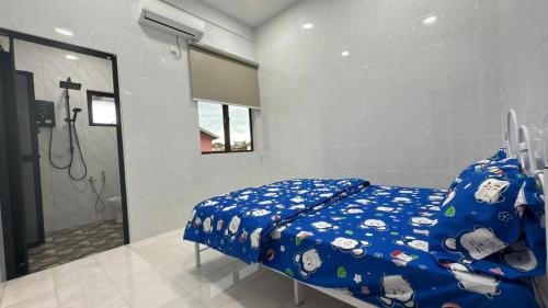 Katil atau katil-katil dalam bilik di Chun Zhi Yen Homestay