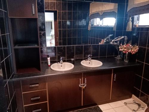 Ένα μπάνιο στο Romaic Guesthouse Welkom