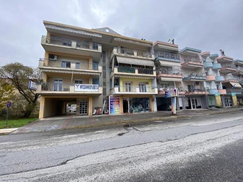 a large building on the side of a street at LaBelle Elite House in Aridaia,Lutra Pozar in Aridaia