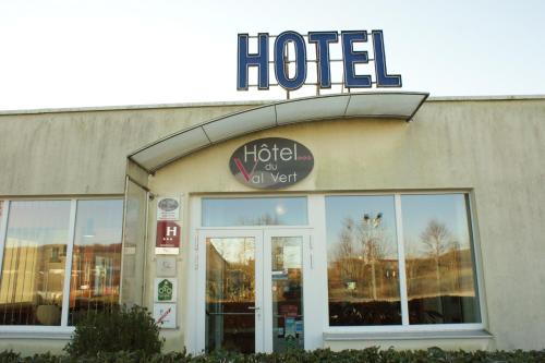 a hotel sign on the side of a building at Hotel Val Vert in Pouilly-en-Auxois