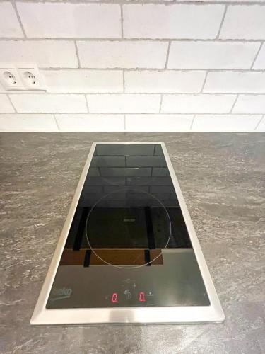 a tablet sitting on the floor in a room at PATAMA Karli Suite - Zentrales City-Feeling nahe Südvorstadt, Uniklinik in Leipzig