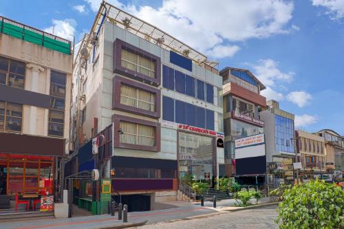 a building on a street in a city at Collection O 29 Church's Inn Near Cubbon Park in Bengaluru