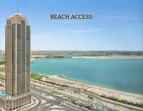 a view of the beach and the skyline of the beachasspectpectheasternheastern at Wyndham Grand Doha West Bay Beach in Doha