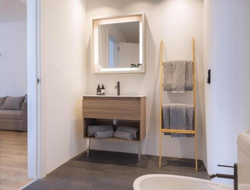 a bathroom with a sink and a mirror at INNSiDE by Meliá Barcelona Aeropuerto in El Prat de Llobregat