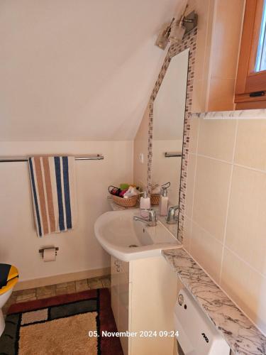 a bathroom with a sink and a mirror at Ferienhaus Lipowa in Lipowa