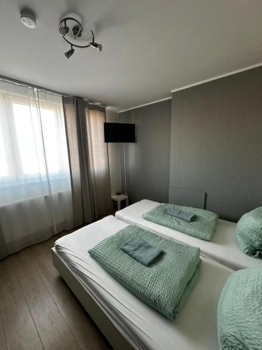 Letto o letti in una camera di Antwerp SportPlaza