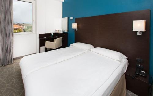 Katil atau katil-katil dalam bilik di Hotel Bonotto