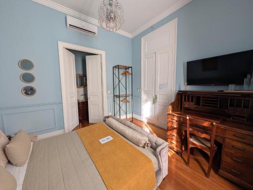 Ένα ή περισσότερα κρεβάτια σε δωμάτιο στο Casa do Vereador