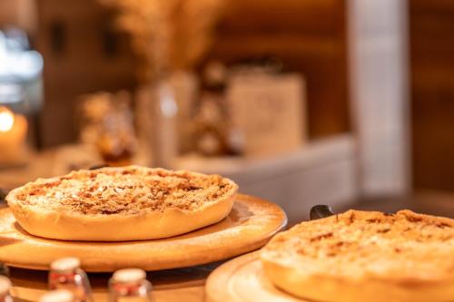 two small pizzas sitting on top of a table at Sonnmatten Boutique Hotel & Apartments Zermatt in Zermatt