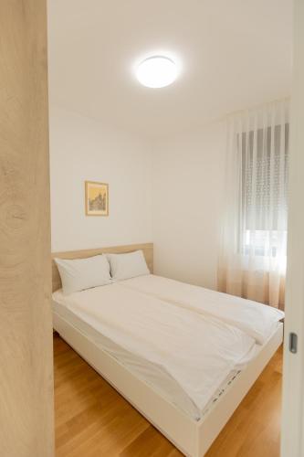 Cama ou camas em um quarto em KAME apartmani 亀