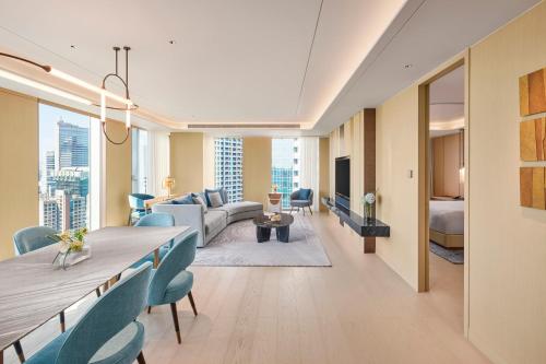 a living room with a dining table and a living room at InterContinental Taichung by IHG in Taichung