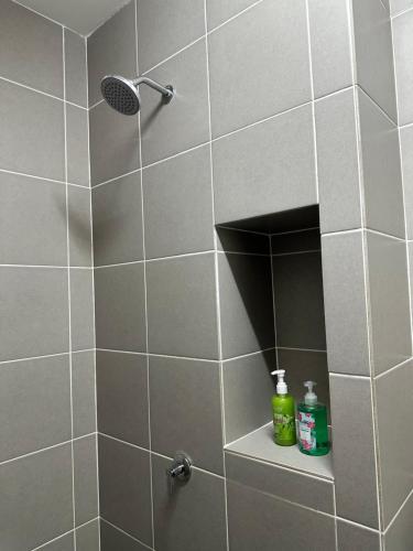 a bathroom with a shower with a shower head at Shah Alam Alinea Linata Studio Seksyen 14 in Shah Alam