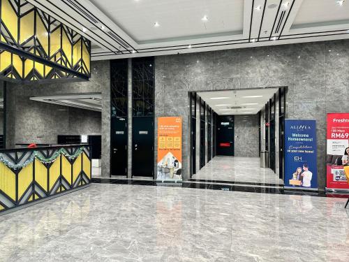 a lobby with black doors and yellow and black walls at Shah Alam Alinea Linata Studio Seksyen 14 in Shah Alam
