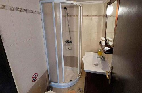 a bathroom with a shower and a sink at Saint Michel Hotel in Rhodes Town