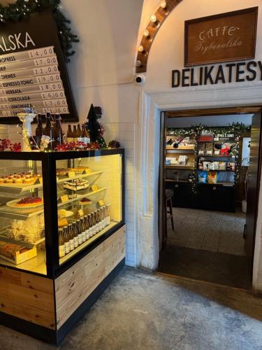 a bakery with a display case with cakes and pastries at Trybunalska in Lublin