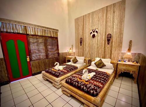 Katil atau katil-katil dalam bilik di Binaria Museum Hotel