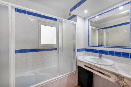 a bathroom with a shower and a sink at Casa das Marés by east ALgarve guest in Tavira