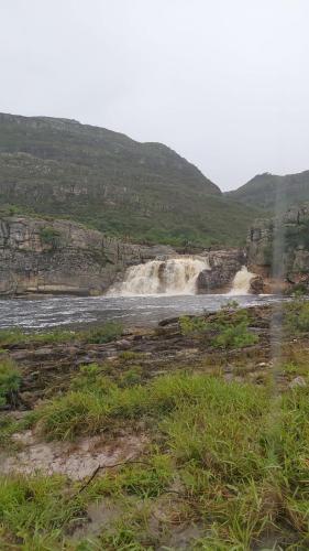 a waterfall in the middle of a river at Chale2RabodeGalo in Santana do Riacho