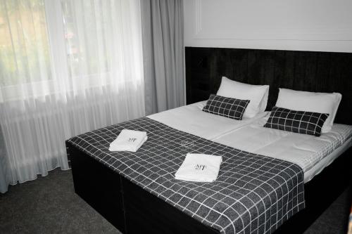 Ein Bett oder Betten in einem Zimmer der Unterkunft Main Spessart Terrasse Hotel