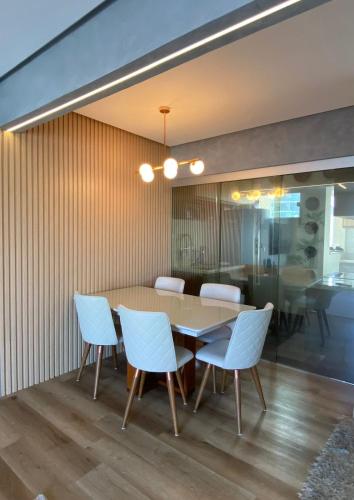 a dining room with a table and chairs at AP Premium COP30 in Belém