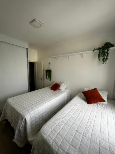 two beds sitting next to each other in a bedroom at AP Premium COP30 in Belém