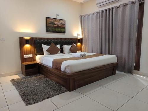 Postel nebo postele na pokoji v ubytování Jungle Hill Resort Coorg