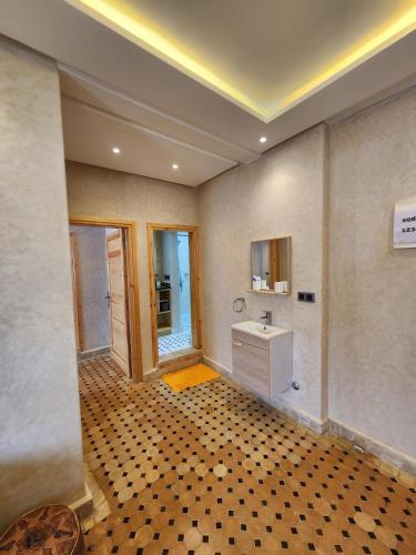 a bathroom with a sink and a mirror at Tirazir House 2 in Mirleft