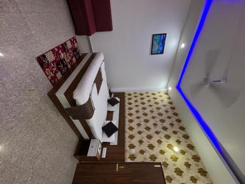an overhead view of a room with a bed and stairs at Hotel Ramay Palace in Ayodhya