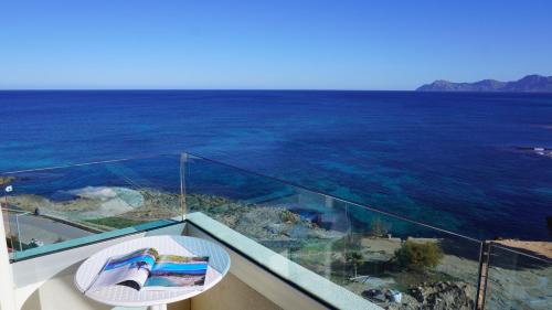 a glass balcony with a view of the ocean at Mar y Paz by Youroom in Can Picafort
