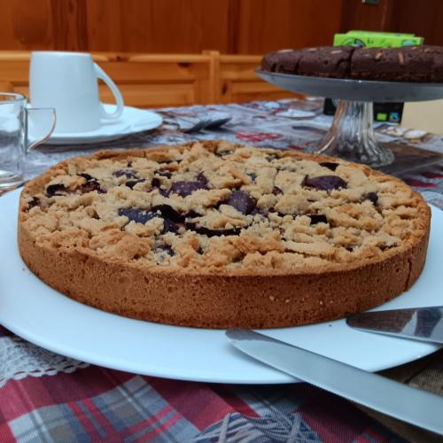 a chocolate chip cookie cake on a plate on a table at Il Sentiero in Verona