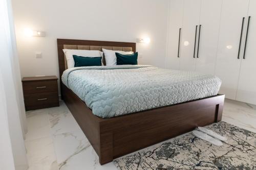 Postel nebo postele na pokoji v ubytování Kozakos Residence