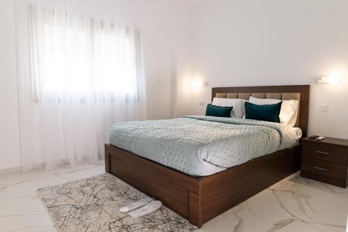 Postel nebo postele na pokoji v ubytování Kozakos Residence