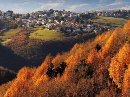 an autumn view of a town on a hill at Il Sentiero in Verona