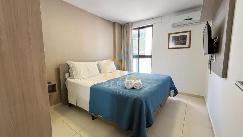 a bedroom with a bed with two towels on it at Eco Summer Tambaú WB Genius Flats in João Pessoa