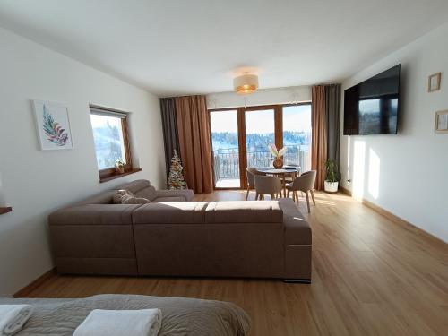 Μια τηλεόραση ή/και κέντρο ψυχαγωγίας στο Apartament Dwa Słońca