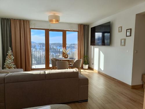 Μια τηλεόραση ή/και κέντρο ψυχαγωγίας στο Apartament Dwa Słońca