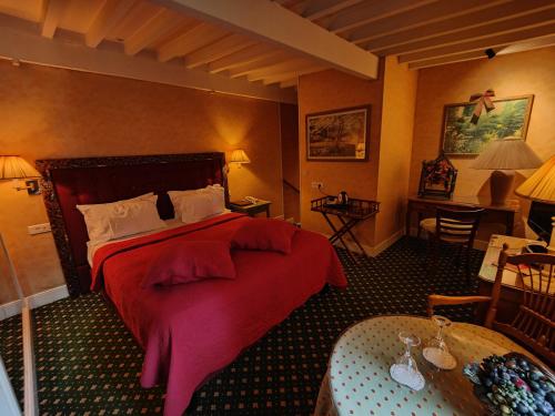 Letto o letti in una camera di Le Relais Médicis